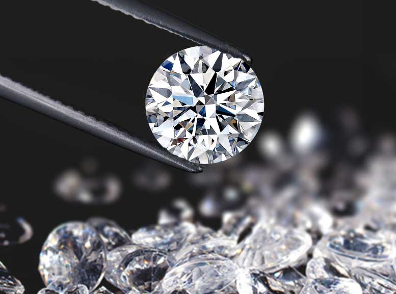 A diamond delicately held by tweezers, showcasing precision and elegance in craftsmanship.